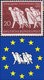 Il primo dei due francobolli tedeschi e il logo Uese